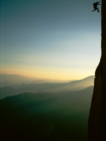 A Rock Climber from the 90 Degree Face of a Mountain Wall