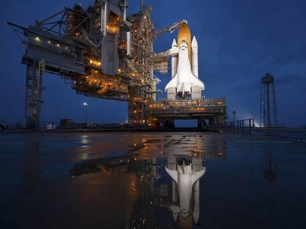 Night View of Space Shuttle Atlantis on the Launch Pad at Kennedy Space Center, Florida